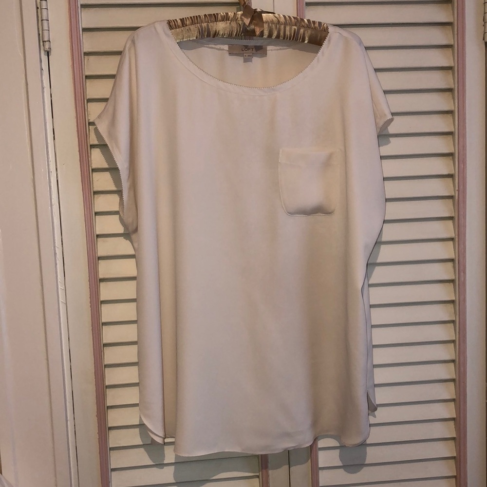 Loft top with pocket